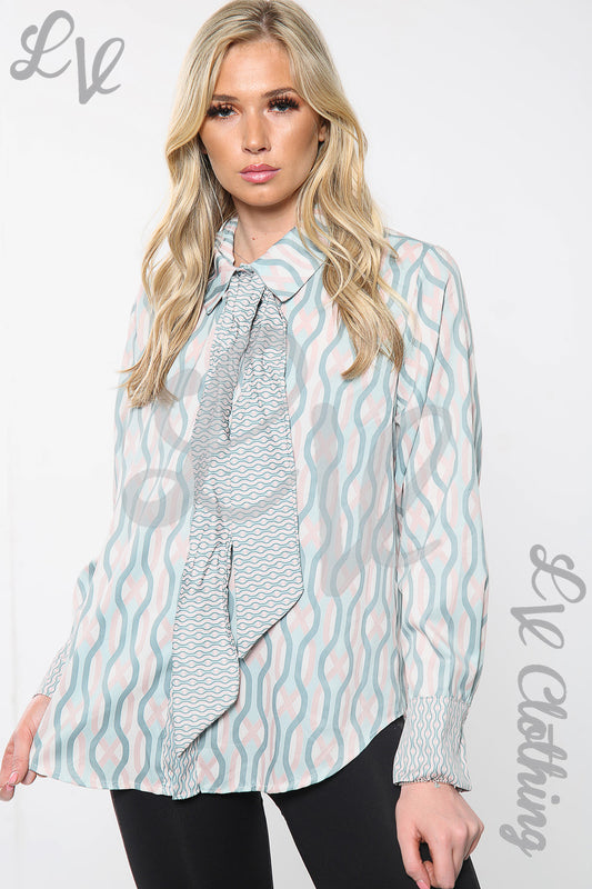 Bow tie neck printed blouse with light blue wave pattern and long sleeves