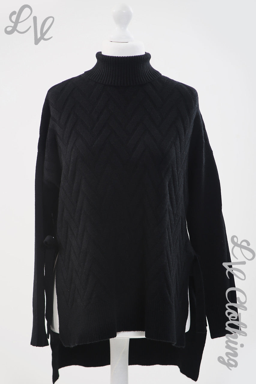 Ladies Zig-Zag Imprint Jumper With High Neck and Tie Side Detail Black - Unit Price £16.99