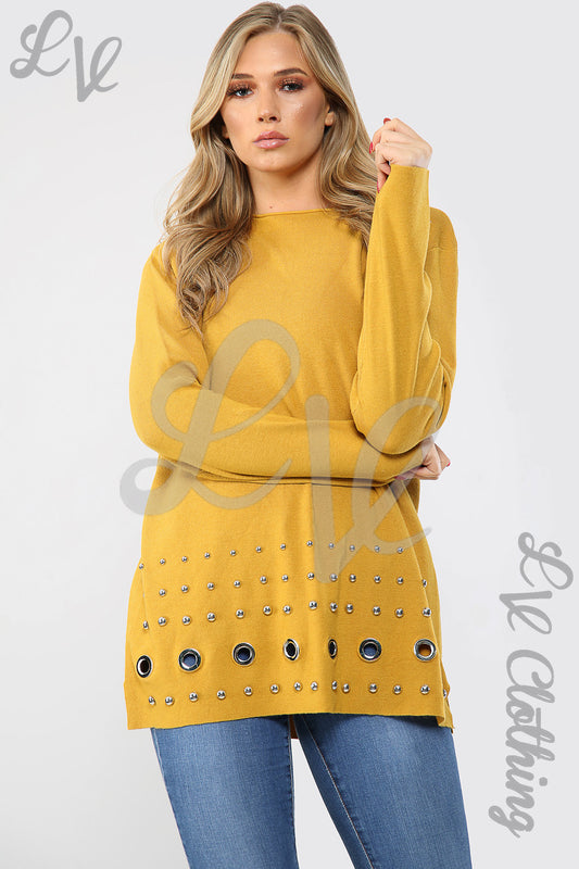 Mustard long-sleeve jumper with studded trim along the hem and cuffs