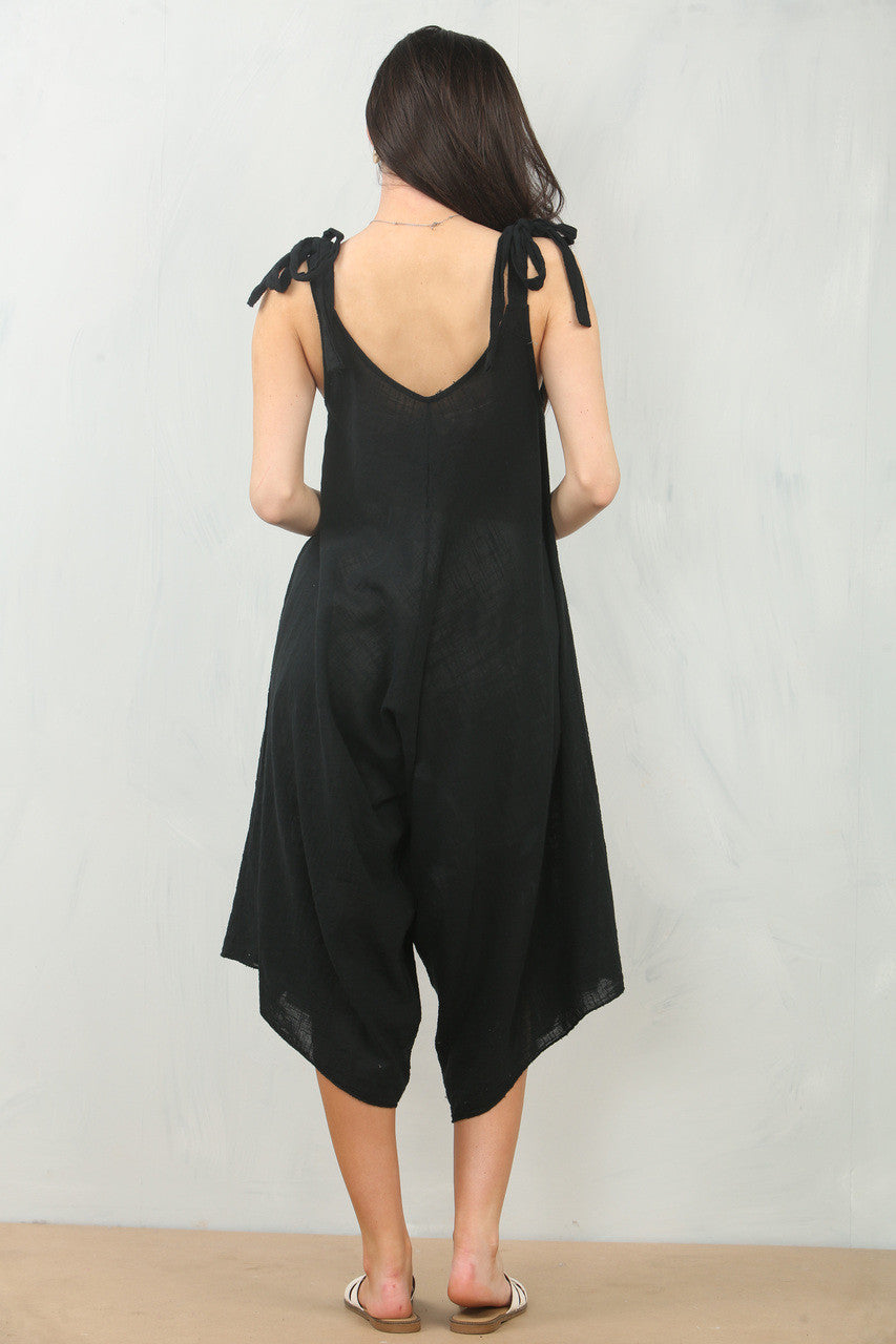 JUMPSUIT ZWARTE KATOEN MET STRIKJES OP DE SCHOUDER