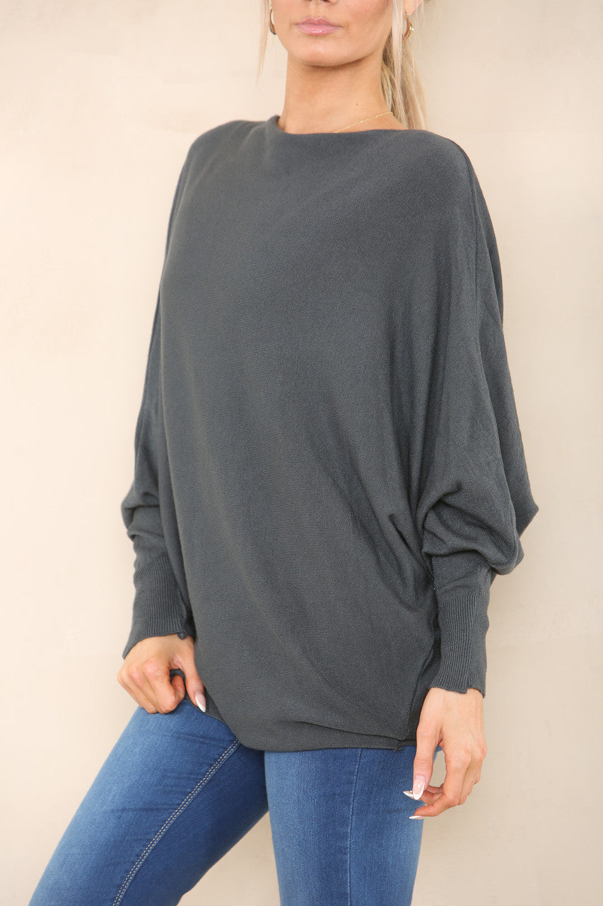 ZACHT GEBREIDE ASYMMETRISCHE BATWING TRUI HOUTSKOOL