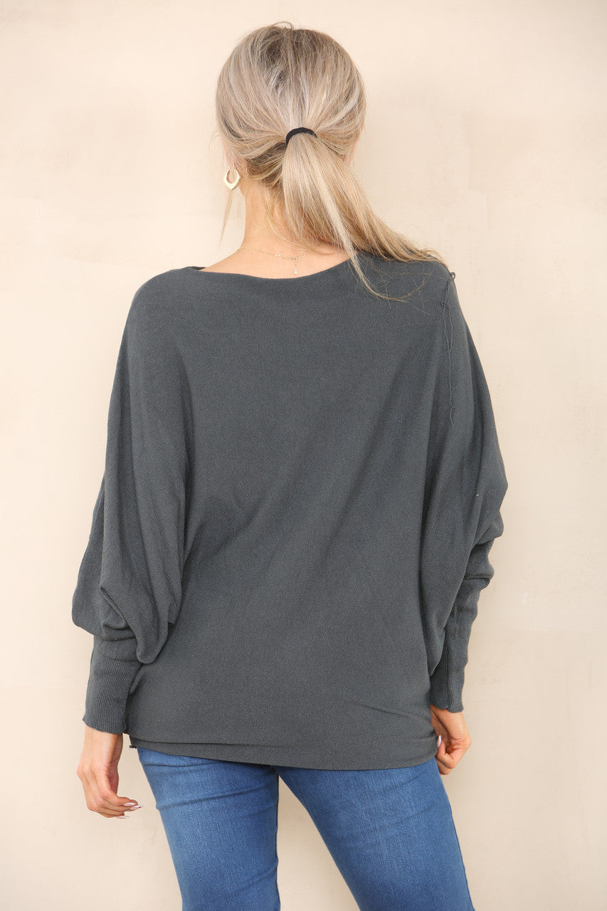 ZACHT GEBREIDE ASYMMETRISCHE BATWING TRUI HOUTSKOOL