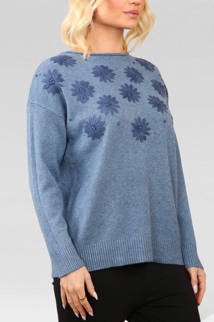 GEBREIDE TRUI MET GEBORDUURDE BLOEMENSPARKELTJE MET DENIM