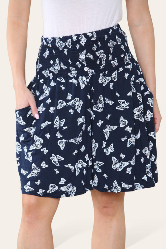 SKORTS MET VLINDERPRINT EN ELASTISCHE TAILLEBAND MARINEBLAUW