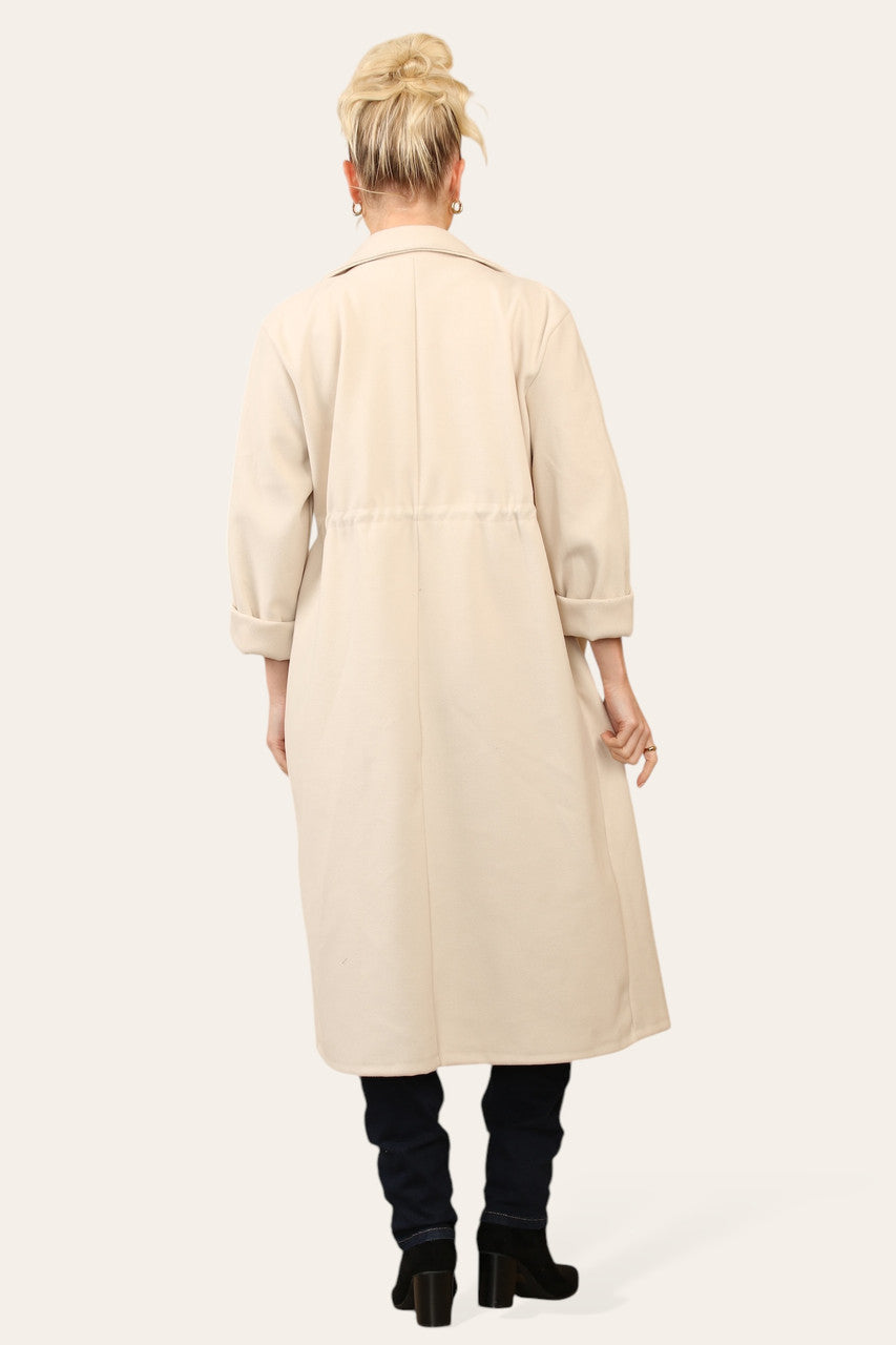 OVERSIZED JAS MET TREKKOORD IN DE TAILLE BEIGE