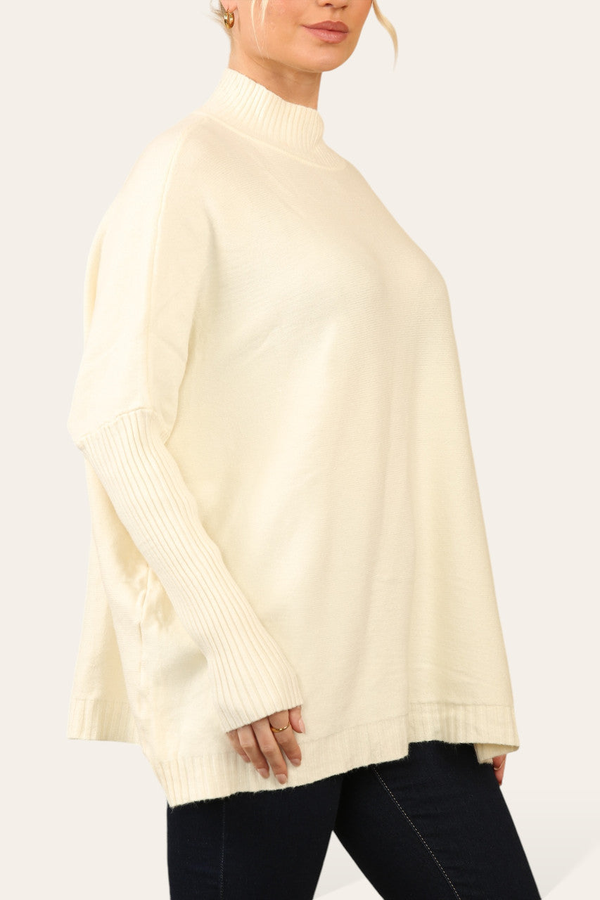 RIBGEBREIDE TRUI MET HOGE HALS BEIGE