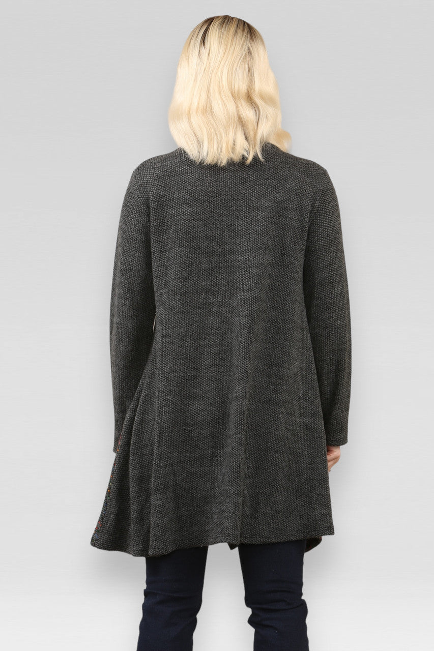 SPACE GEBREIDE PATCHWORK JURK HOUTSKOOL