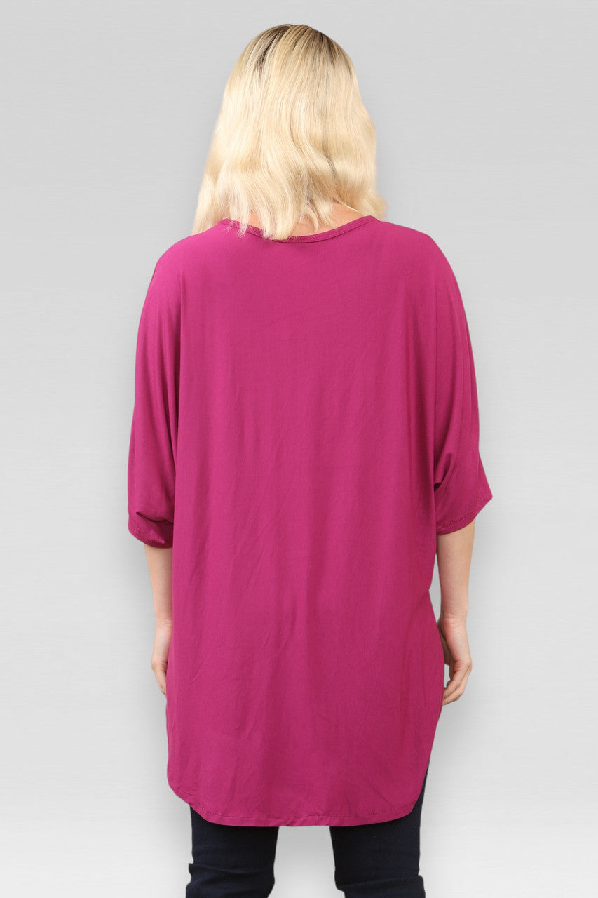 DOORZICHTIGE TOP MET SPLIT IN MAGENTA