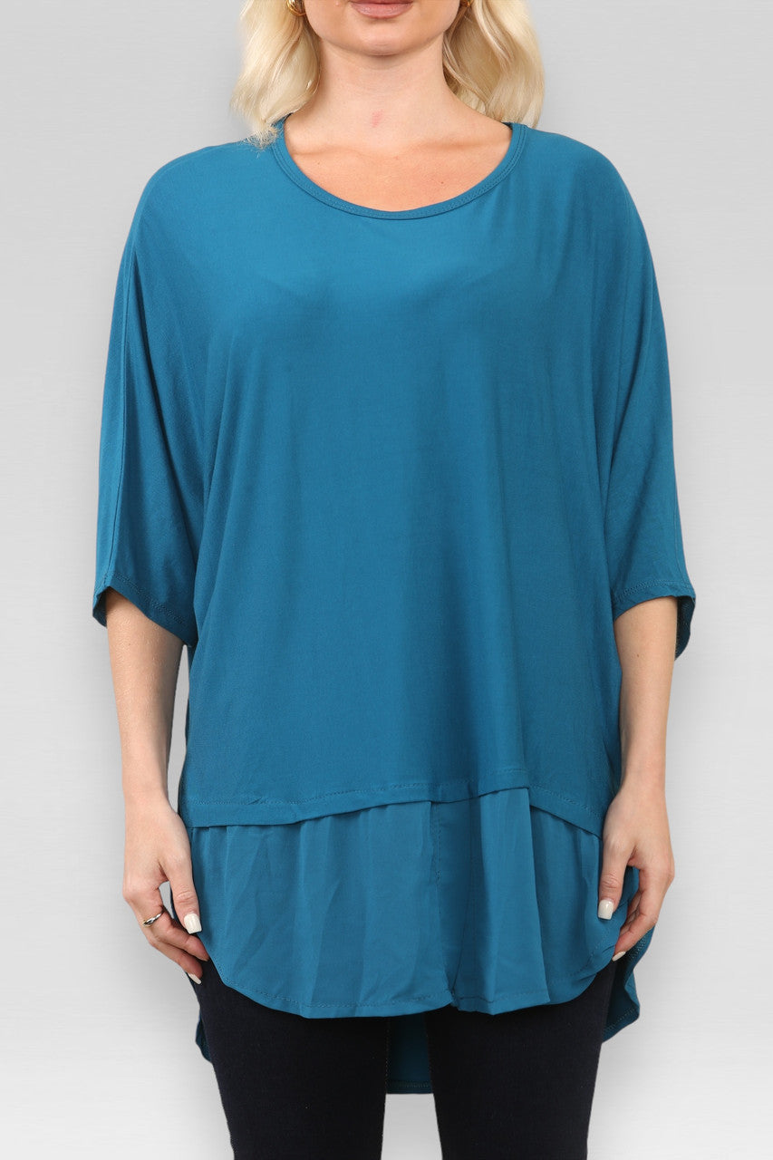 DOORZICHTIGE TOP MET SPLIT IN TEAL