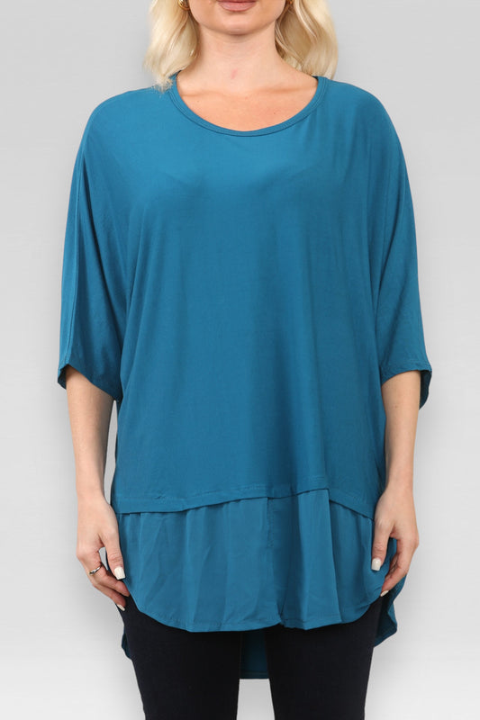 DOORZICHTIGE TOP MET SPLIT IN TEAL
