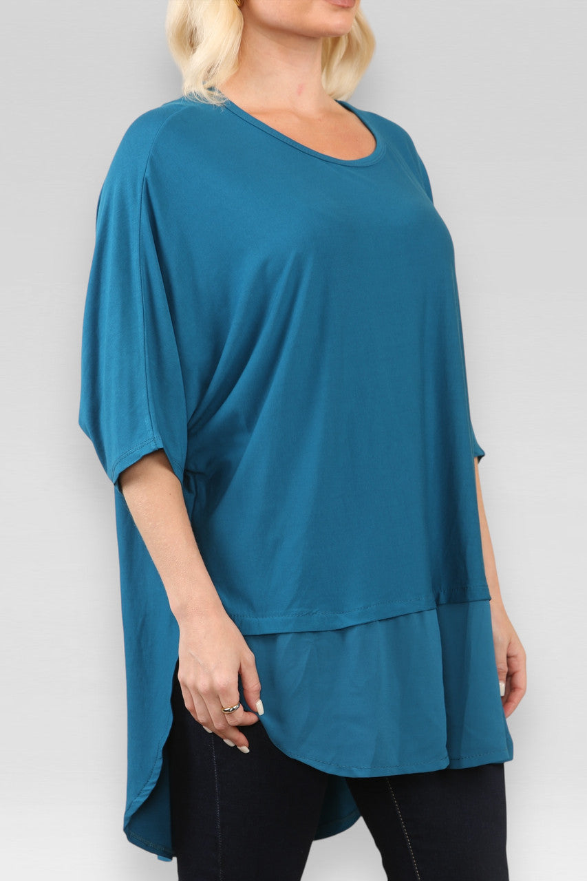 DOORZICHTIGE TOP MET SPLIT IN TEAL