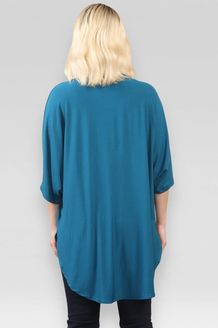 DOORZICHTIGE TOP MET SPLIT IN TEAL