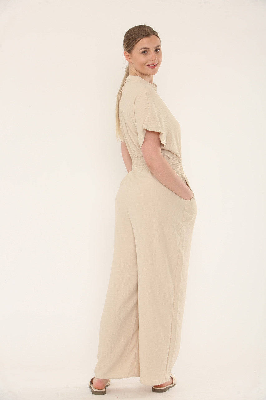 JUMPSUIT MET KORTE MOUWEN EN ELASTISCHE TAILLE - ZAND