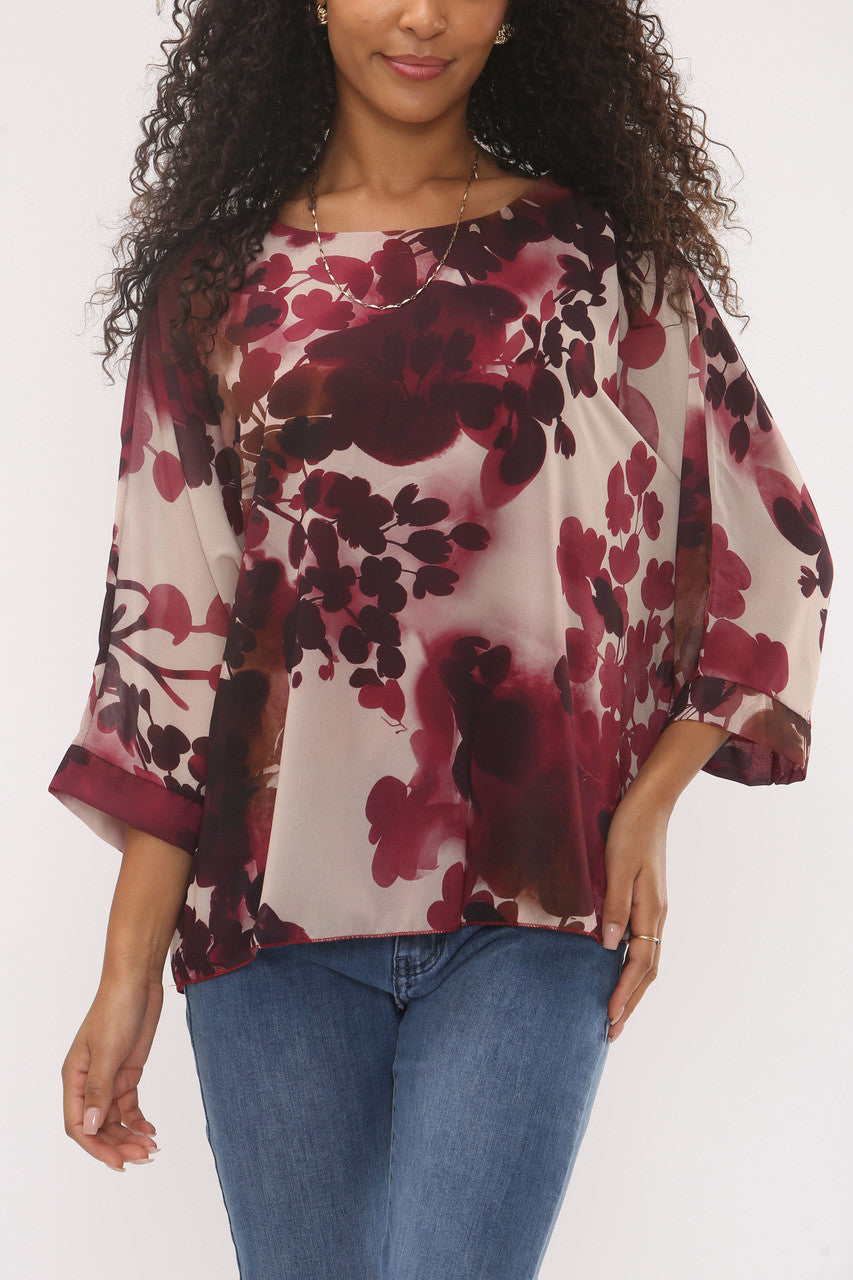 BLOUSE MET ABSTRACTE BLAD SILHOUET EN FRAMBOZENKLEURIGE PRINT