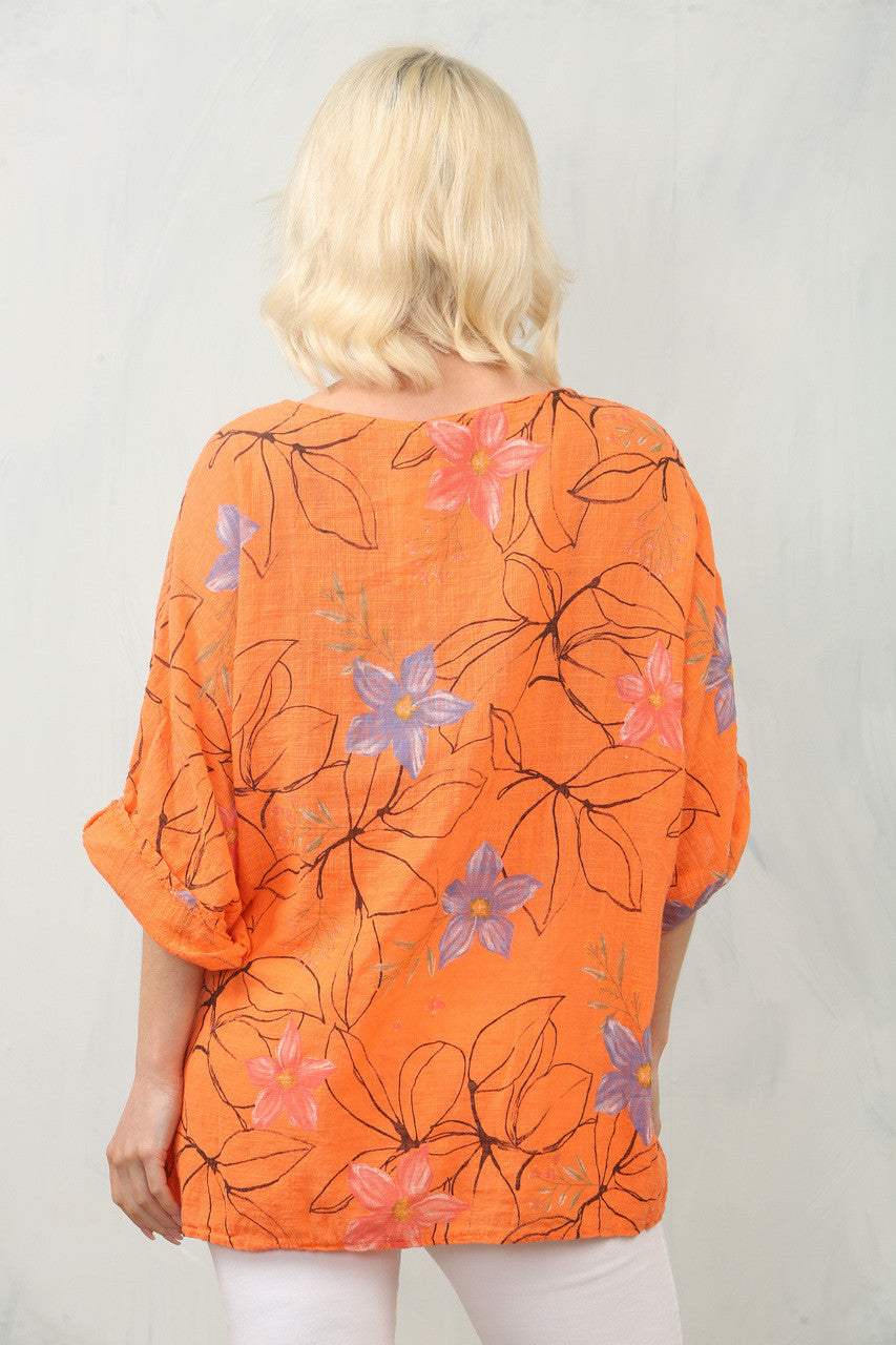 TOP MET BLOEMENSTENCILPRINT - ORANJE