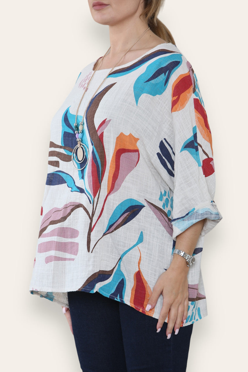 TOP MET ABSTRACTE BLADERENPRINT EN STRASS-STEENTJES