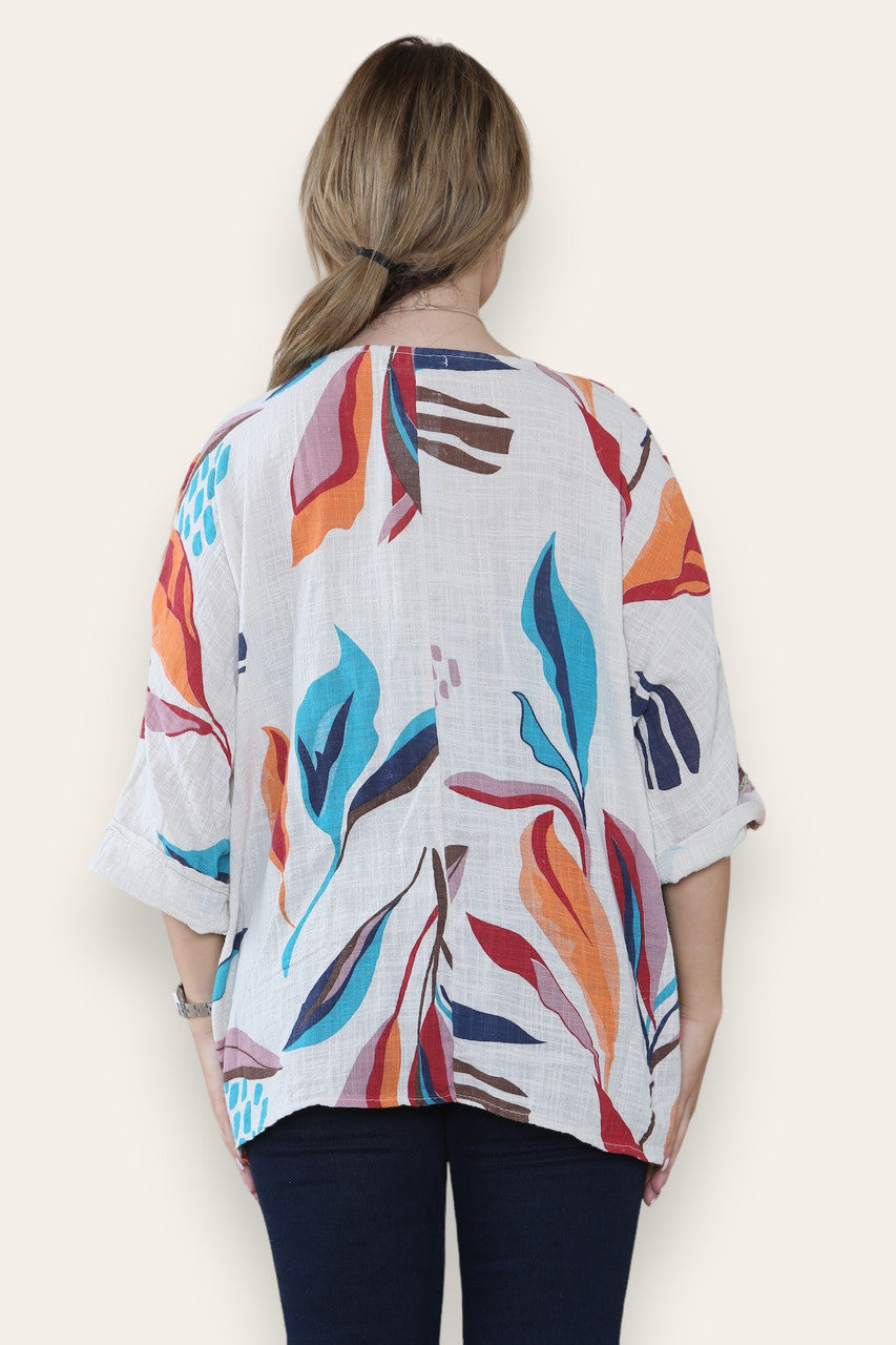 TOP MET ABSTRACTE BLADERENPRINT EN STRASS-STEENTJES