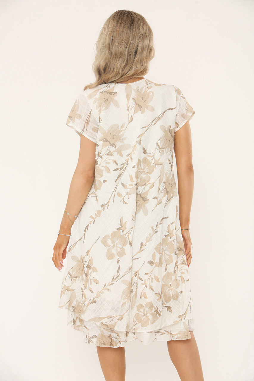 UITLOPEND JURKJE MET VERSPREIDE BLOEMENPRINT - BEIGE