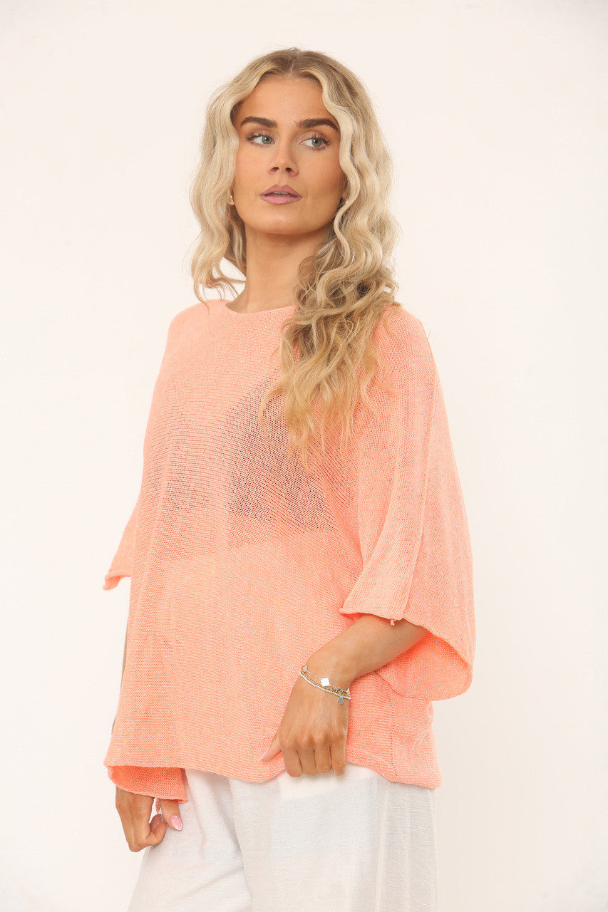 OVERSIDED GEBREIDE TOP MET VLEERMUISMOUWEN - PERZIK