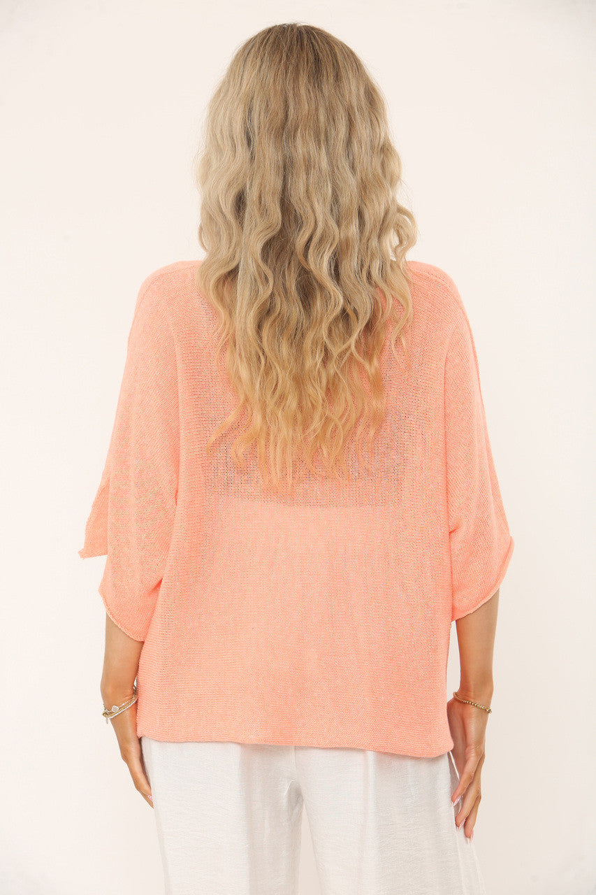 OVERSIDED GEBREIDE TOP MET VLEERMUISMOUWEN - PERZIK