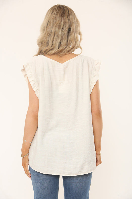 Cream textured top with ruffle sleeves, scoop back and relaxed fit