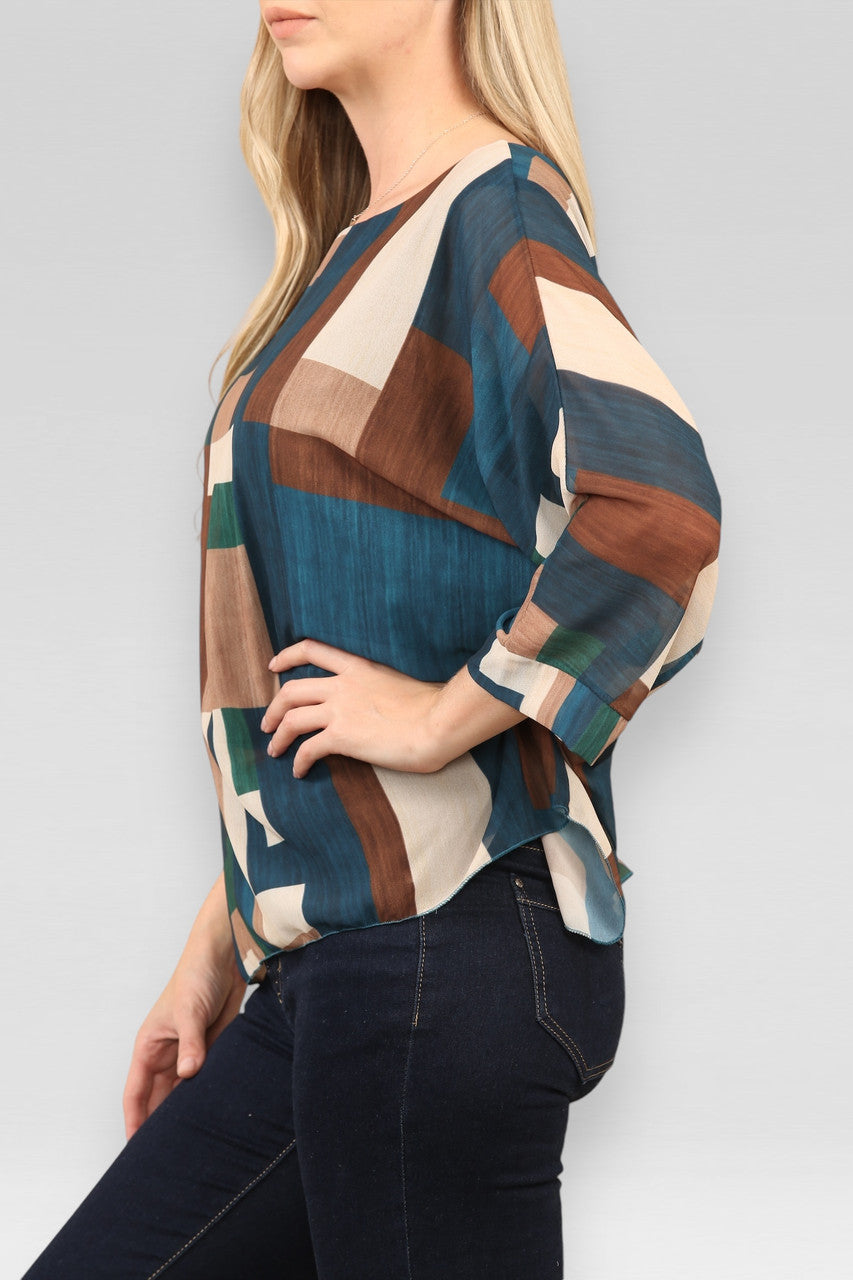 BLOUSE MET VIERKANTEN EN ABSTRACTE PRINT TURKOOIS