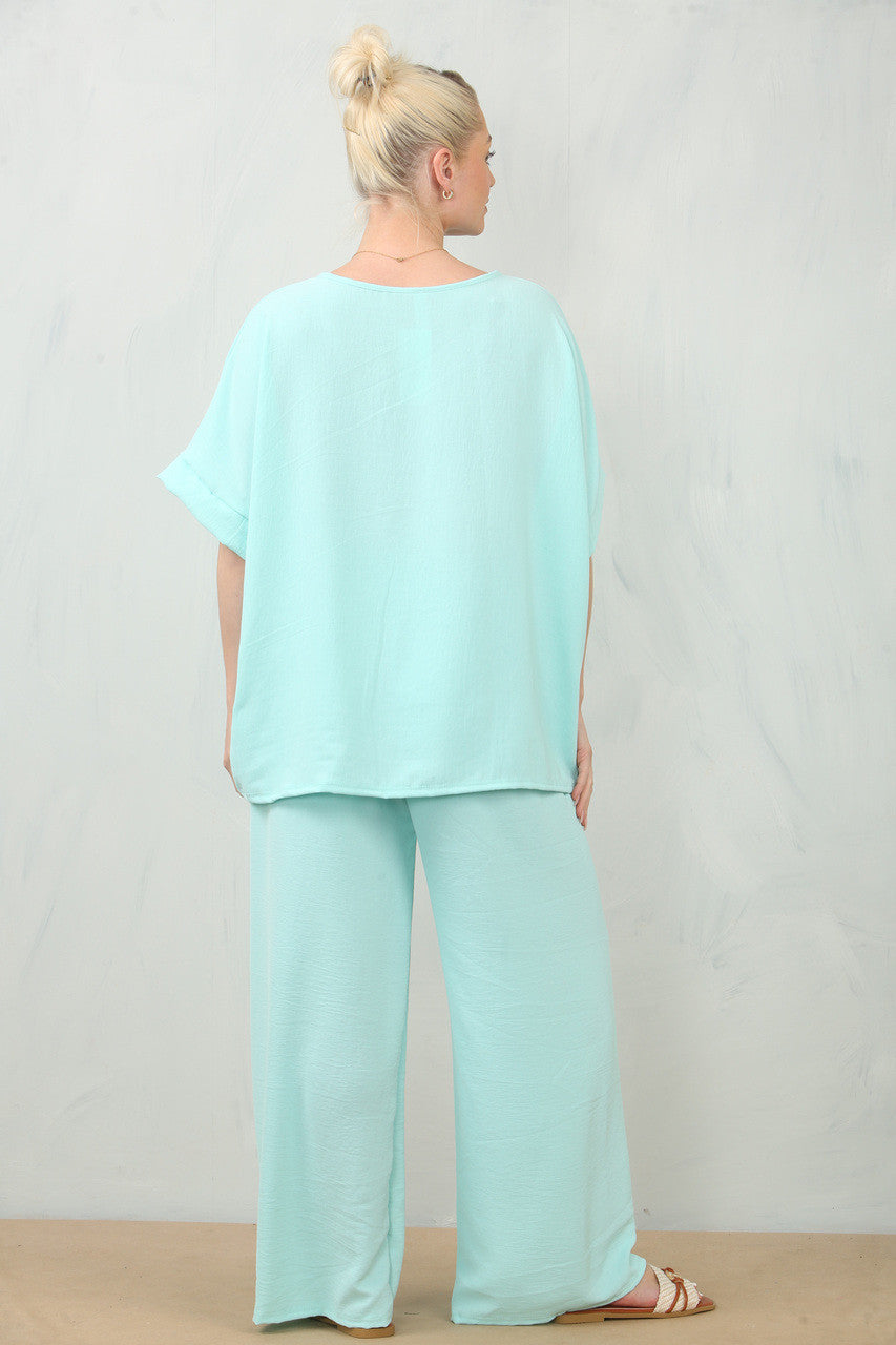 ZWEVENDE BLOEMENCORSAGE TOP & BROEK SET - MINT