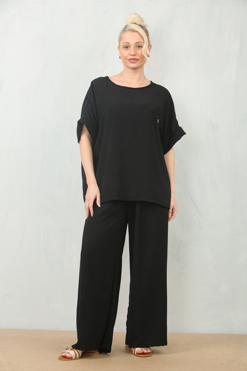 LUCHTERSIGE BLOEMEN CORSAGE TOP & BROEK SET - ZWART