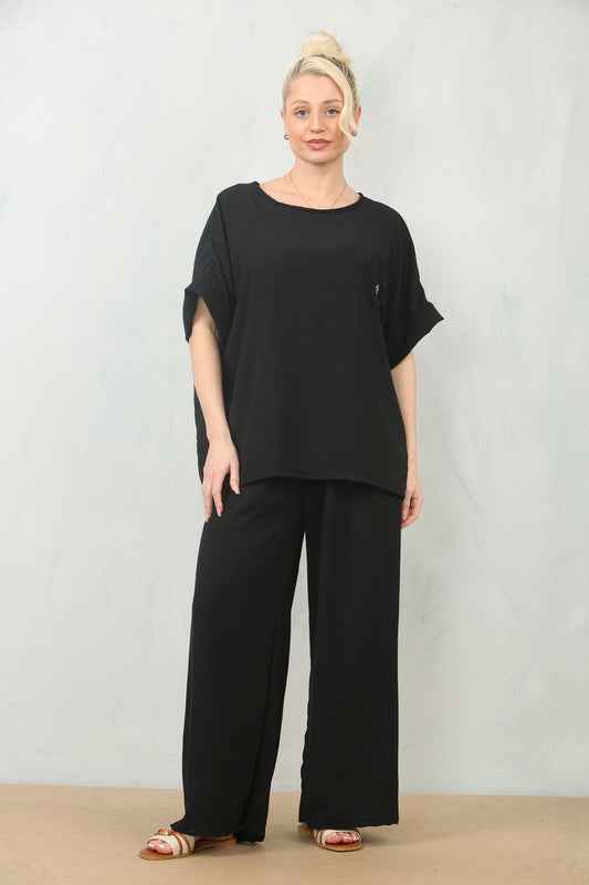 LUCHTERSIGE BLOEMEN CORSAGE TOP & BROEK SET - ZWART