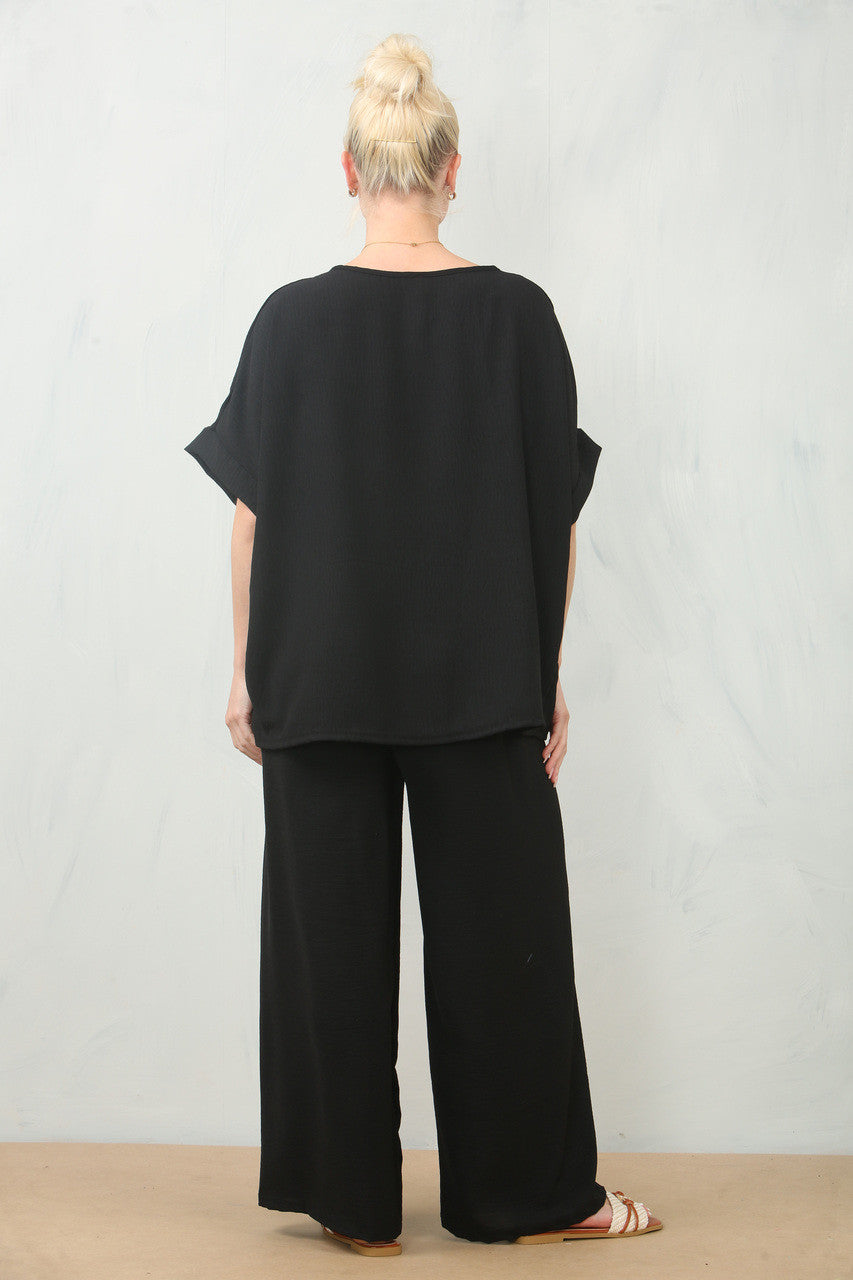 LUCHTERSIGE BLOEMEN CORSAGE TOP & BROEK SET - ZWART