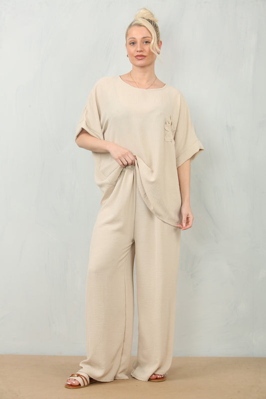 ZWEVENDE BLOEMENCORSAGE TOP & BROEK SET - STEEN