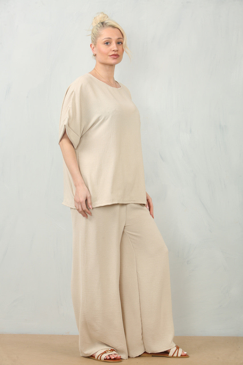 ZWEVENDE BLOEMENCORSAGE TOP & BROEK SET - STEEN