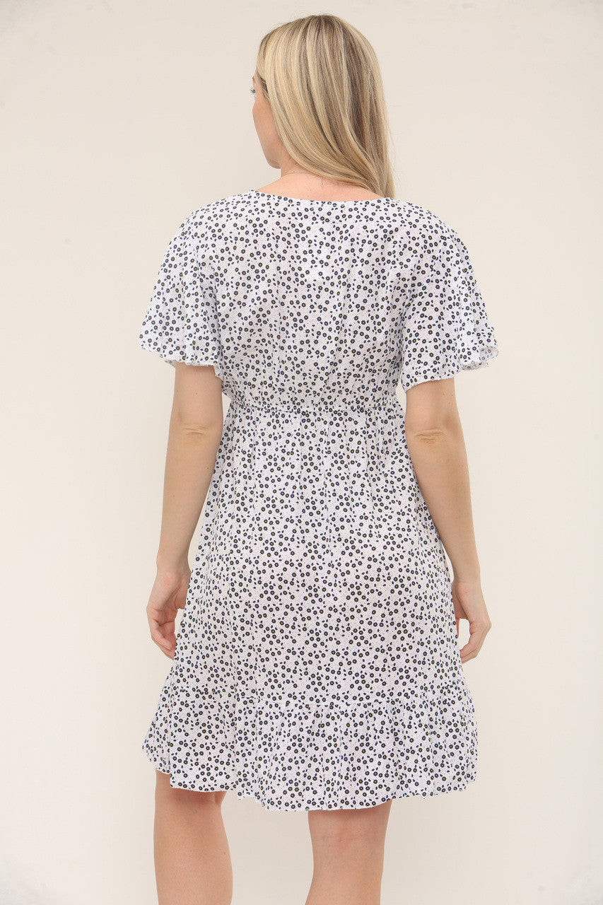 JURK MET KLEINE BLOEMPRINT EN KNOPENSLUITING – WIT