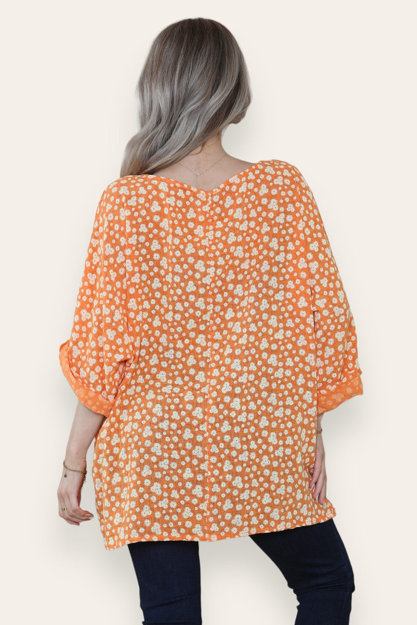 BLOES MET BLOEMENPRINT EN ONREGELMATIG PATROON ORANJE