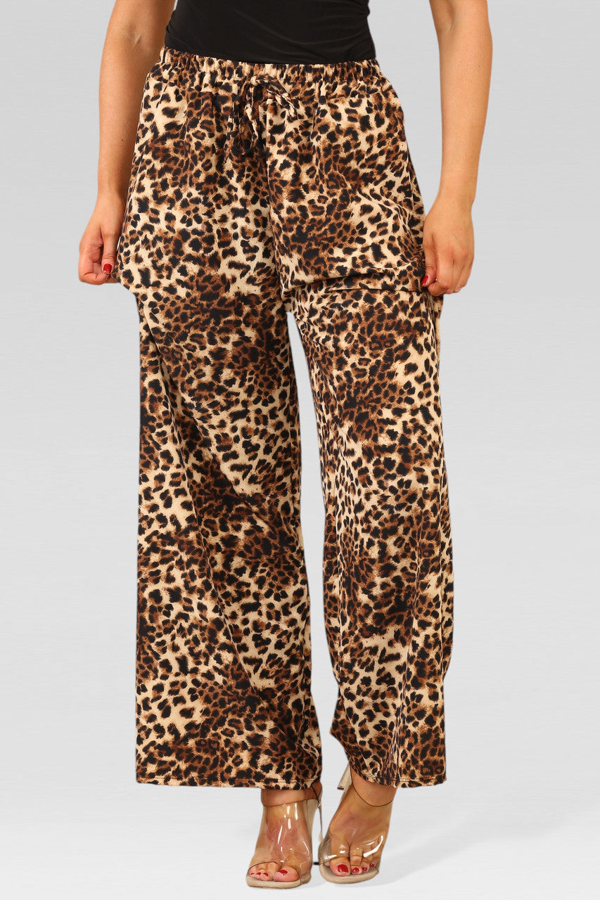 BROEKEN MET BREDE PIJPEN, ELASTIEKE TAILLE EN CHEETAHPRINT