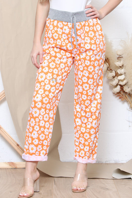 Dames joggingbroek met madeliefjesprint oranje