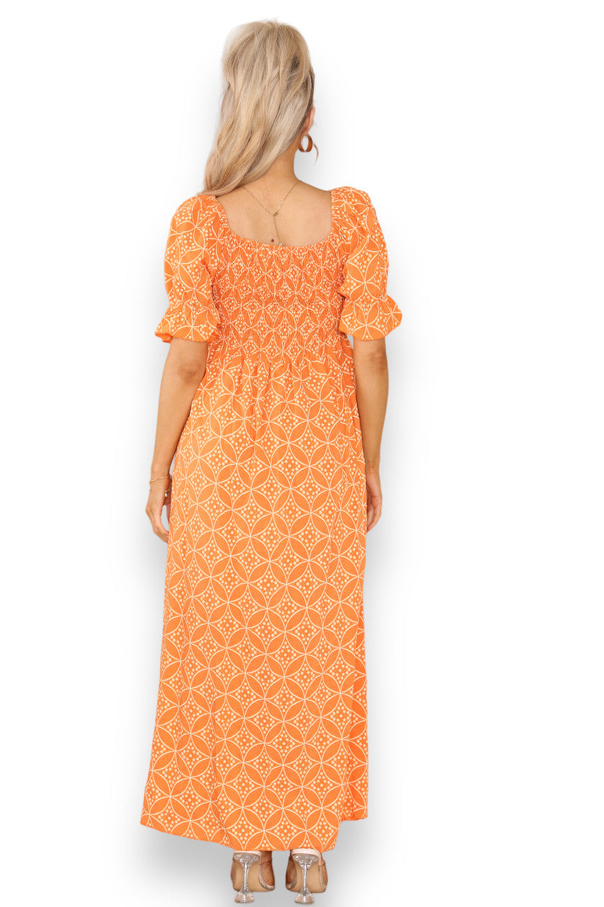 FLADDERIGE GEOMETRISCHE BLOEMEN BARDOT MAXIJURK ORANJE