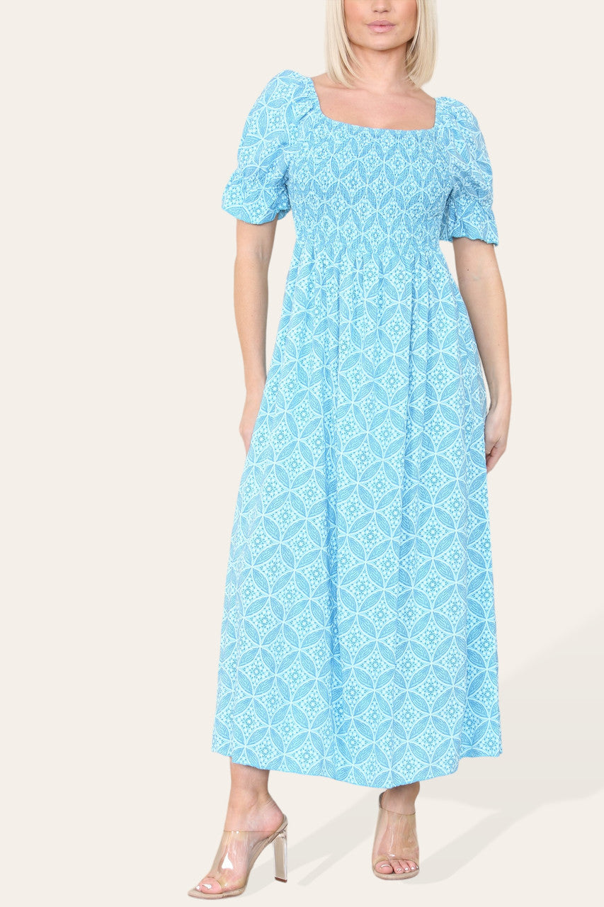 MAXIJURK MET GEOMETRISCHE BLOEMPRINT EN BARDOT-HALS TURKOOIS