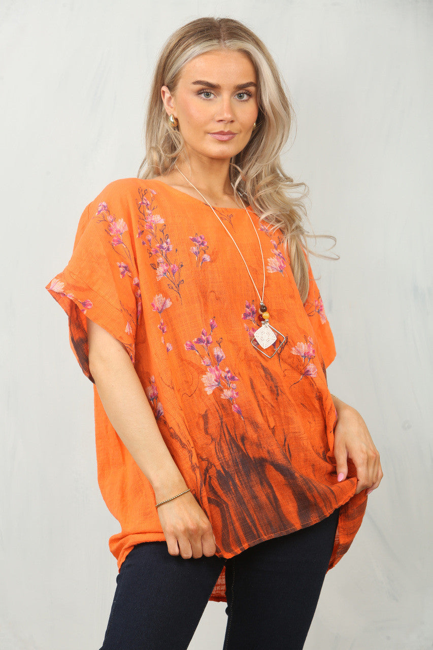 TOP MET BLOEMENRANDPRINT - ORANJE