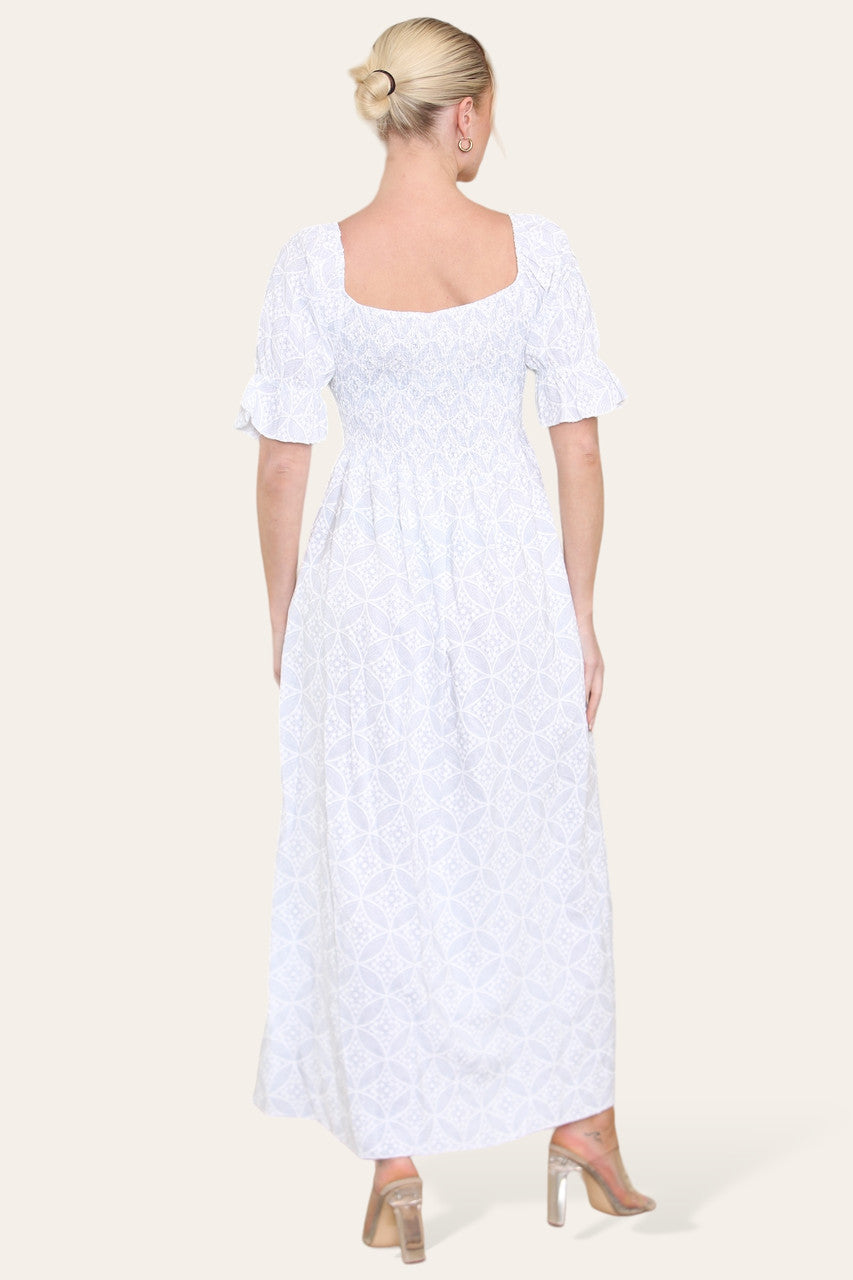 WITTE MAXIJURK MET GEOMETRISCHE BLOEMENPRINT EN BARDOT-HALS