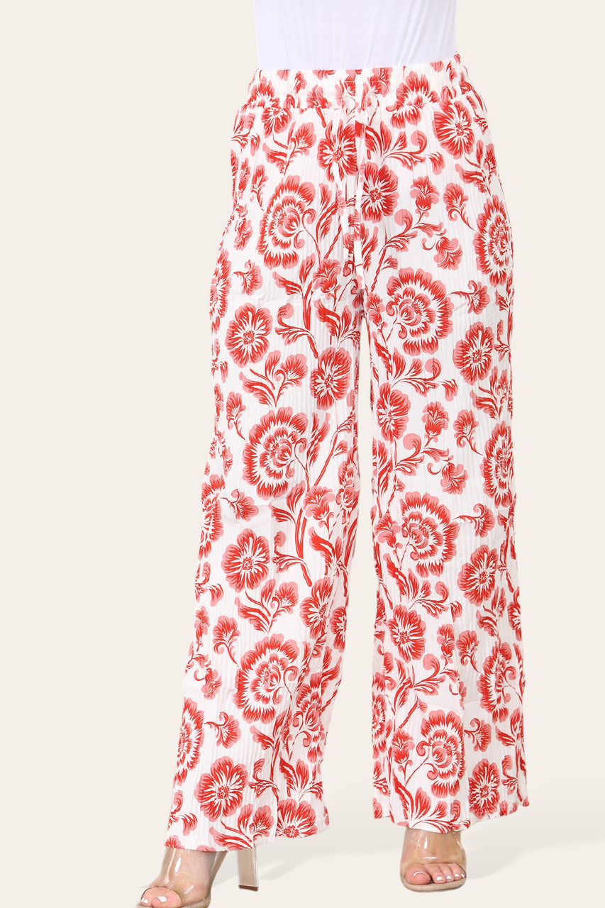 BROEK MET ELASTISCHE TAILLE, WIJDE PIJPEN, GEPLOOID EN MET BLOEMEN BAROKPRINT
