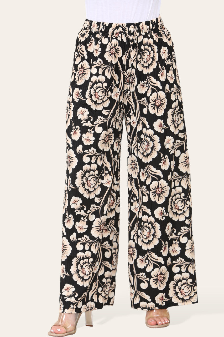 BROEK MET ELASTISCHE TAILLE, WIJDE PIJPEN, GEPLOOID EN MET BLOEMEN BAROKPRINT