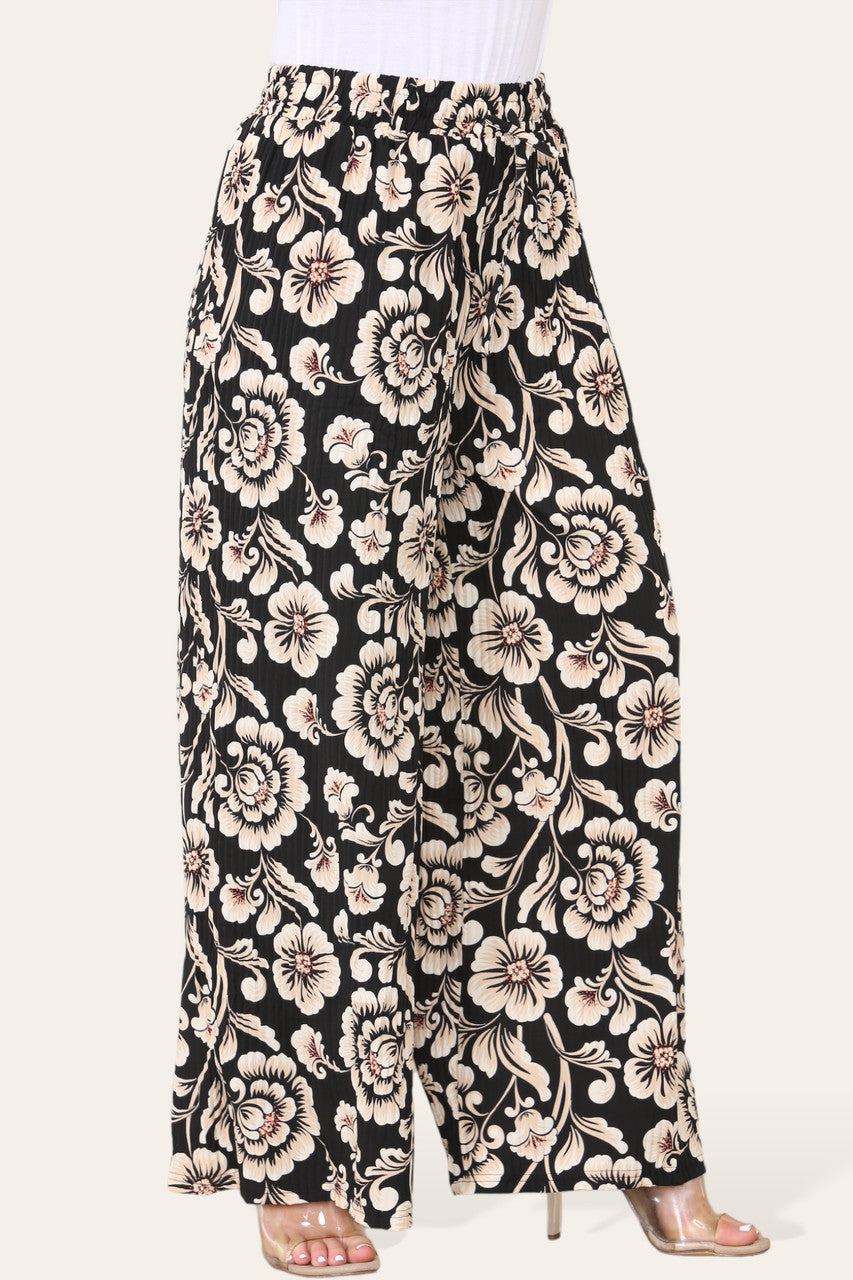 BROEK MET ELASTISCHE TAILLE, WIJDE PIJPEN, GEPLOOID EN MET BLOEMEN BAROKPRINT
