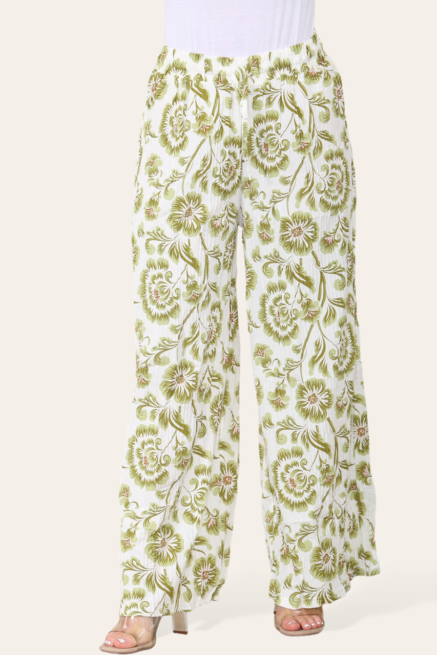 BROEK MET ELASTISCHE TAILLE, WIJDE PIJPEN, GEPLOOID EN MET BLOEMEN BAROKPRINT