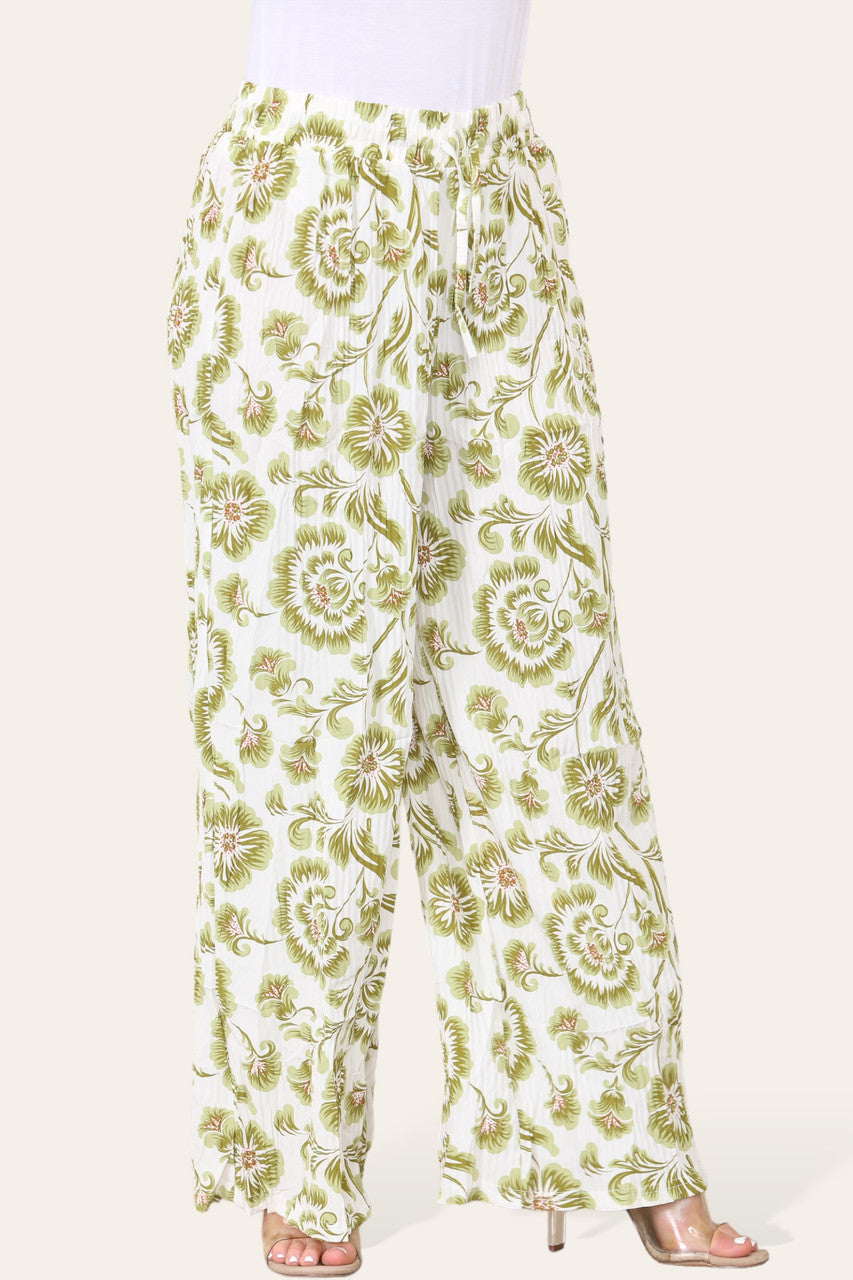 BROEK MET ELASTISCHE TAILLE, WIJDE PIJPEN, GEPLOOID EN MET BLOEMEN BAROKPRINT