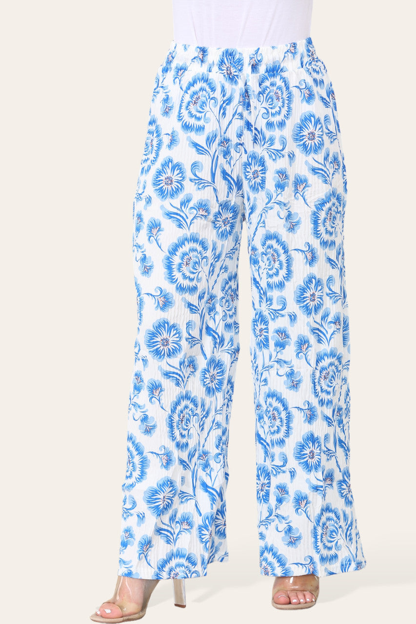 BROEK MET ELASTISCHE TAILLE, WIJDE PIJPEN, GEPLOOID EN MET BLOEMEN BAROKPRINT