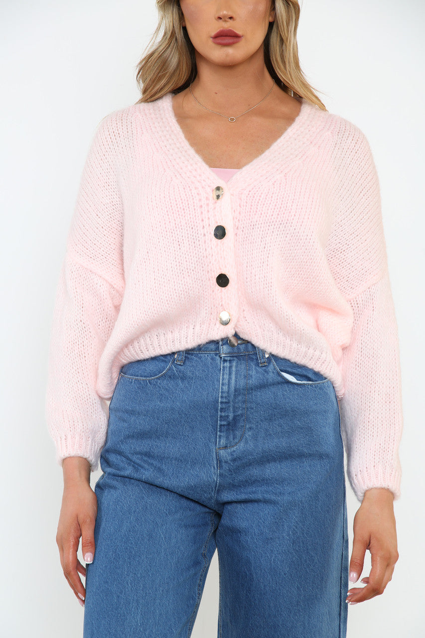 Dames pluizig gebreid vest met knopen aan de voorkant roze