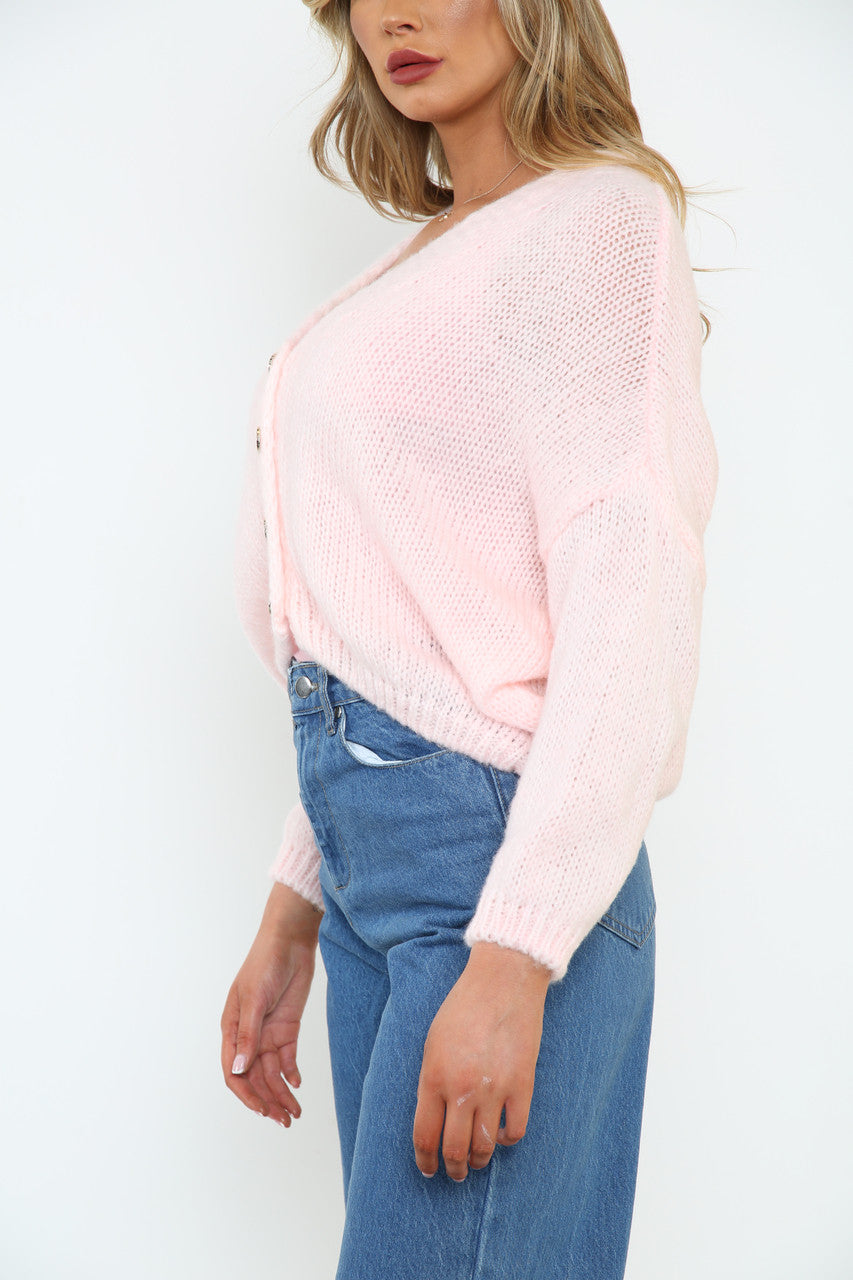 Dames pluizig gebreid vest met knopen aan de voorkant roze
