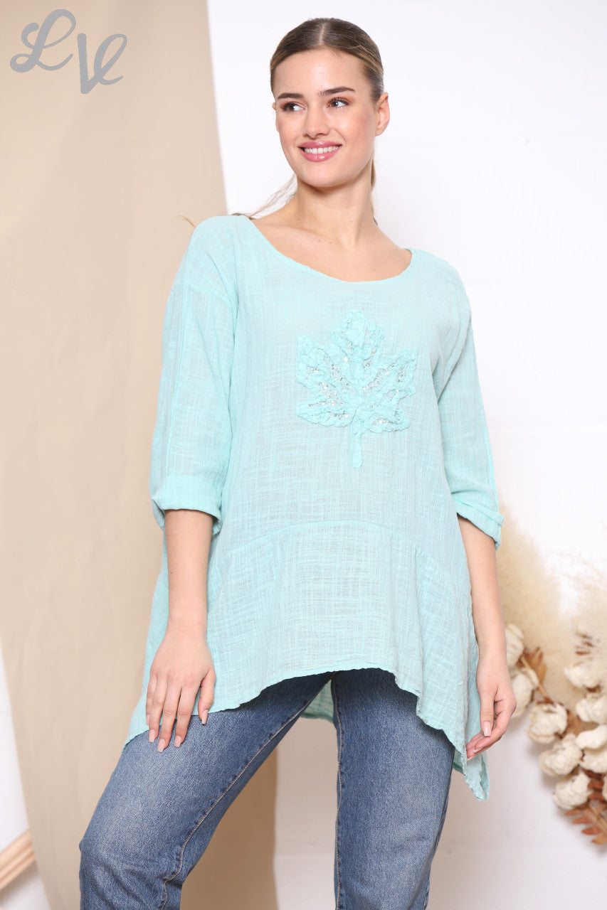 Dames top met lovertjes, ruches en bladprint Tiffany
