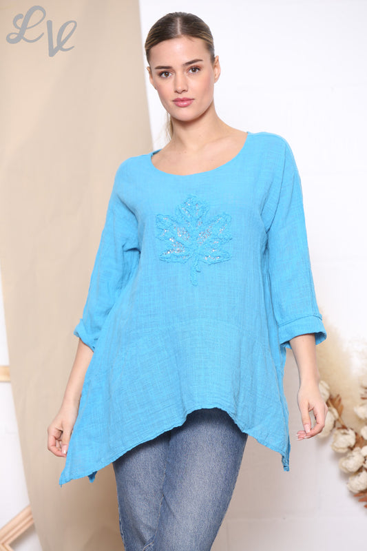 Dames Top met lovertjes, ruches en bladerenprint Turkoois
